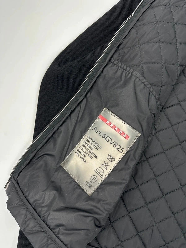 Prada black hybrid jacket with padded nylon body and wool sleeves, vintage 2006 collection.
