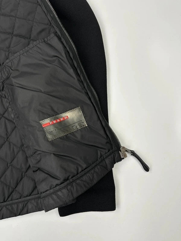 Prada black hybrid jacket with padded nylon body and wool sleeves, vintage 2006 collection.