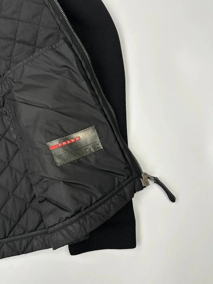 Prada black hybrid jacket with padded nylon body and wool sleeves, vintage 2006 collection.